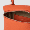 Premium orange leather vanity box handbag with top handle and dual zipper closure for women