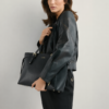 "Elegant Women's black tote bag with gold buckle straps and side lace detail"