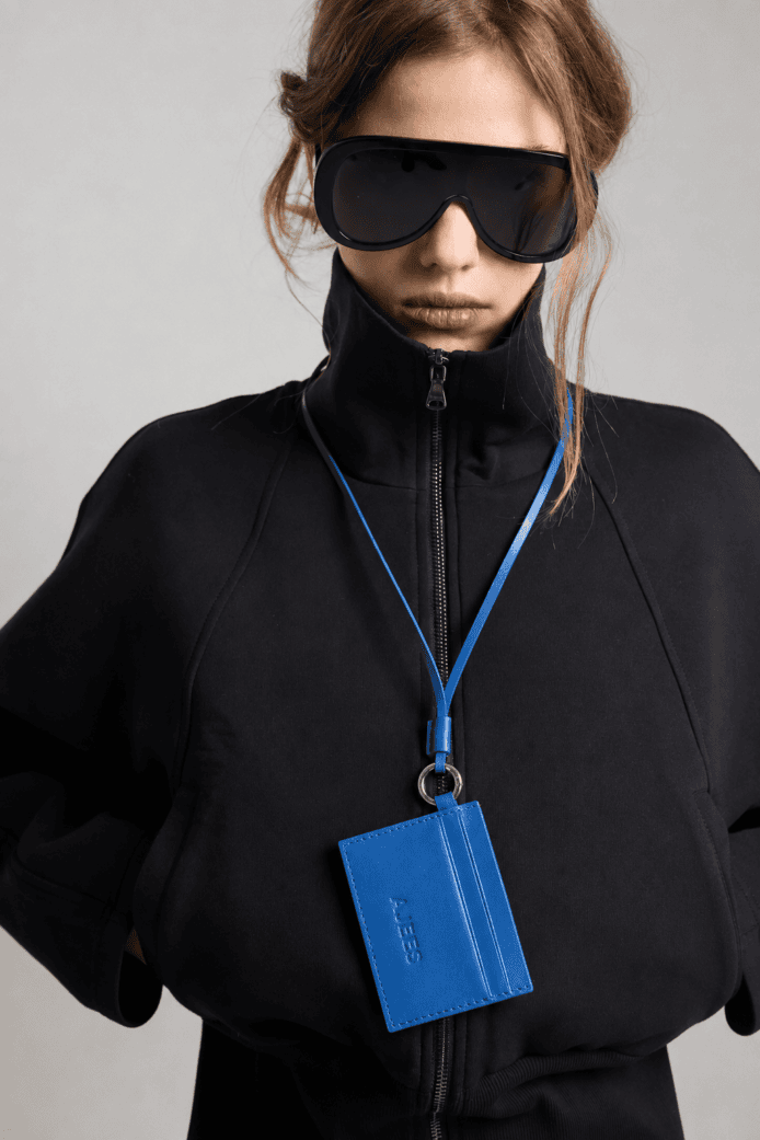 AJEES premium blue genuine leather card holder with lanyard featuring RFID protection and multiple card slots.