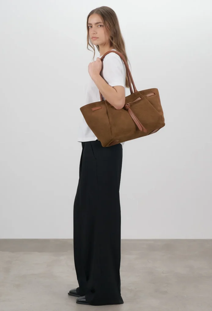 "Hunar Women's tan suede tote bag with knot detail and leather handles"