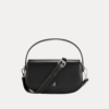 "Black premium leather saddle shoulder bag with curved handle, adjustable shoulder strap, and buckle detail - versatile women's crossbody bag"