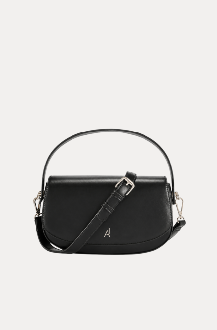 "Black premium leather saddle shoulder bag with curved handle, adjustable shoulder strap, and buckle detail - versatile women's crossbody bag"