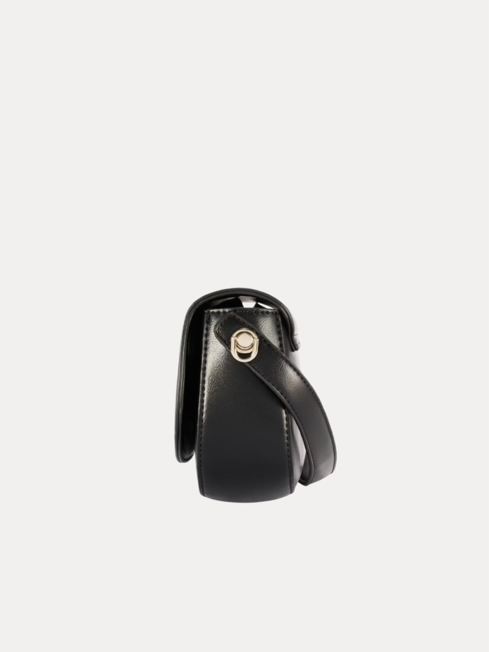 "Black premium leather saddle shoulder bag with curved handle, adjustable shoulder strap, and buckle detail - versatile women's crossbody bag"