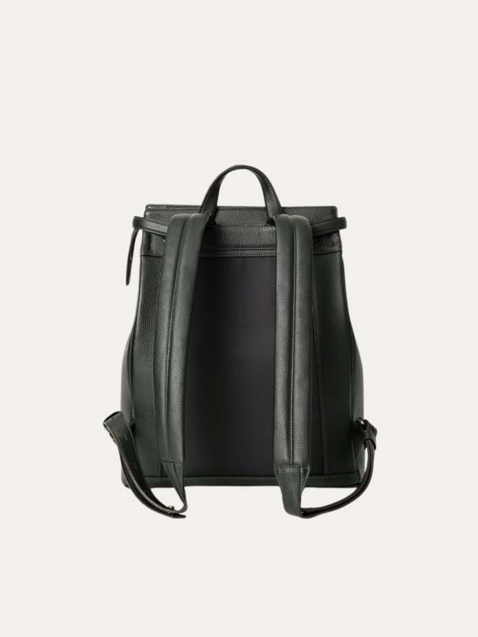 Close-up of the Noble backpack top latch closure and brass hardware detailing.