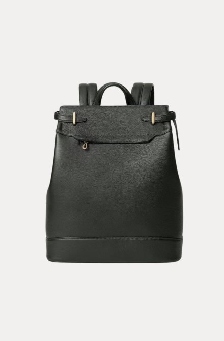 Close-up of the Noble backpack top latch closure and brass hardware detailing.