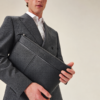 Delsaro black leather travel bag by AJEES Leather with minimalist design and premium textured leather.