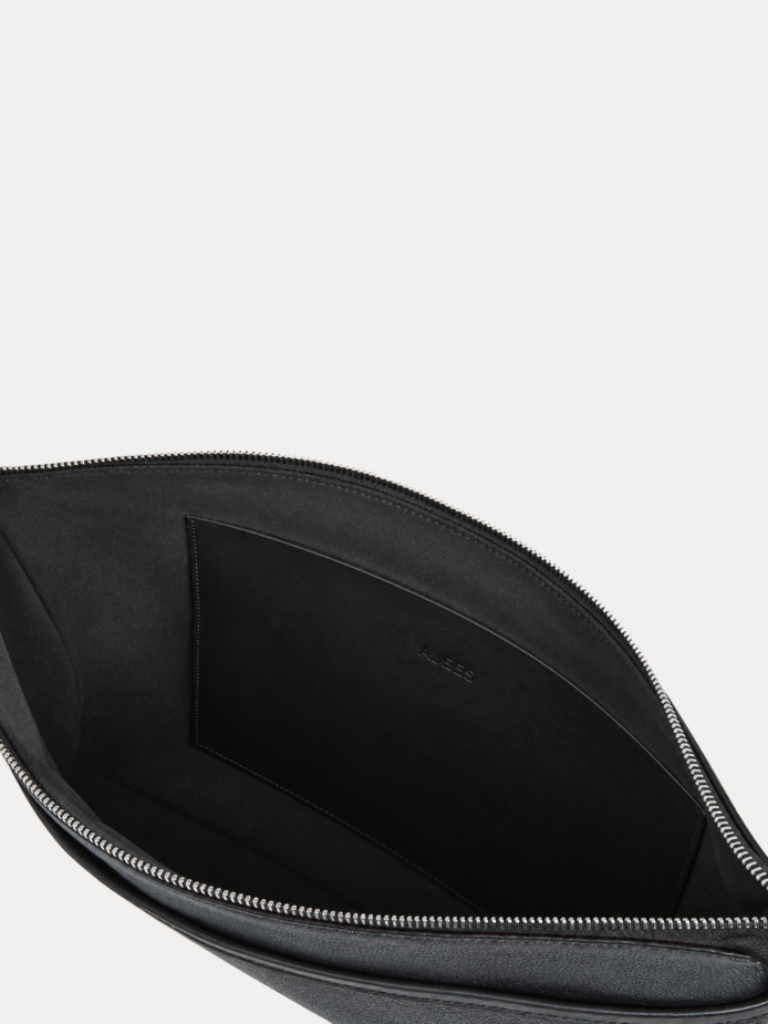 Delsaro black leather travel bag by AJEES Leather with minimalist design and premium textured leather.
