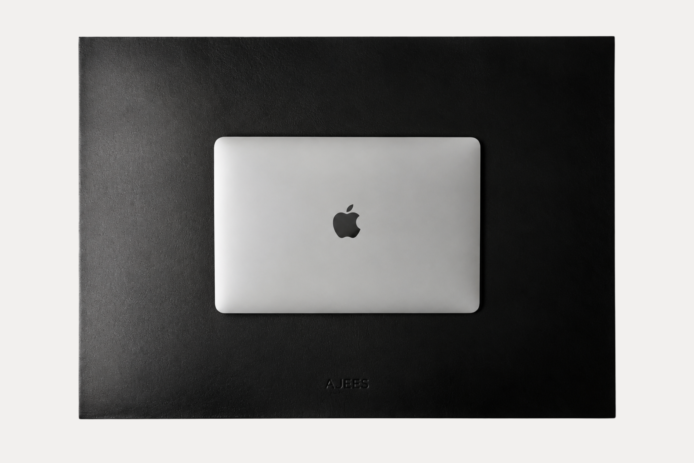 AJEES Premium Leather Desk Mat with laptop and mouse on a black leather office desk mat.