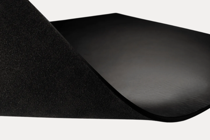 AJEES Premium Leather Desk Mat with laptop and mouse on a black leather office desk mat.