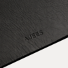 AJEES Premium Leather Desk Mat with laptop and mouse on a black leather office desk mat.