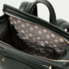 Close-up of the Noble backpack top latch closure and brass hardware detailing.