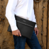 Black leather Iron Travel Bag with front zip pocket by AJEES