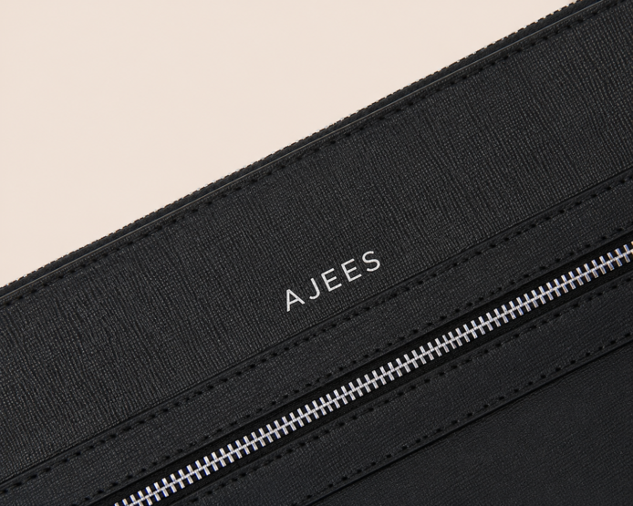 Black leather Iron Travel Bag with front zip pocket by AJEES