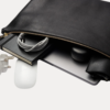 Black leather Late laptop bag with gold zipper and embossed AJEES logo